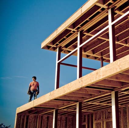 Man standing on timber construction